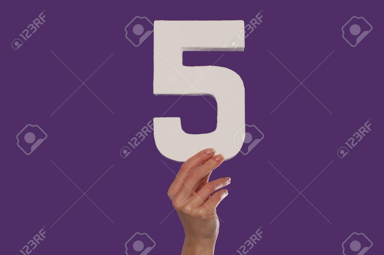16096940-female-hand-holding-up-the-number-5-against-a-purple-background-conceptual-of-numbers-measurement-am.jpg
